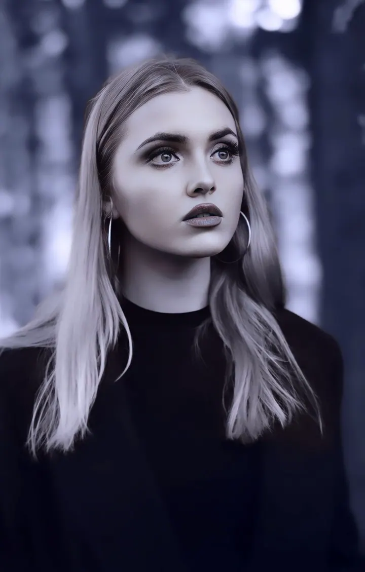 Paula Maria Rosalia in a dark monochrome profile portrait